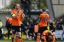 Mark Reynolds, left, applauds the United fans.