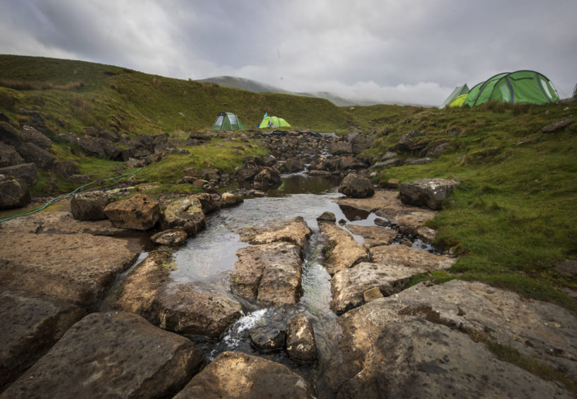 The Fell Beck runs through a campsite close to the entrance of Gaping Gill, the largest cavern in Britain, situated in Yorkshire Dales National Park, ahead of its opening the public next weekend.