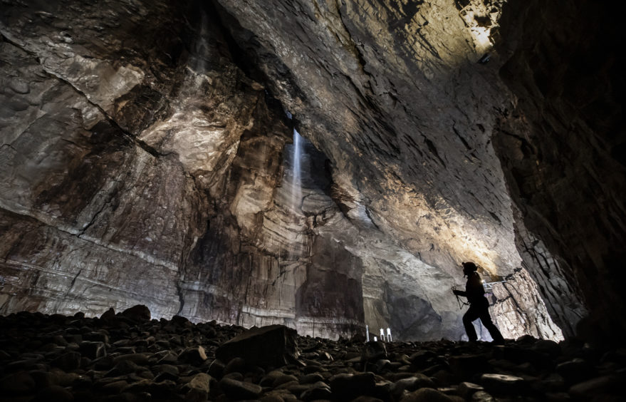 A potholer explores Gaping Gill, the largest cavern in Britain, situated in Yorkshire Dales National Park, ahead of its opening the public next weekend.