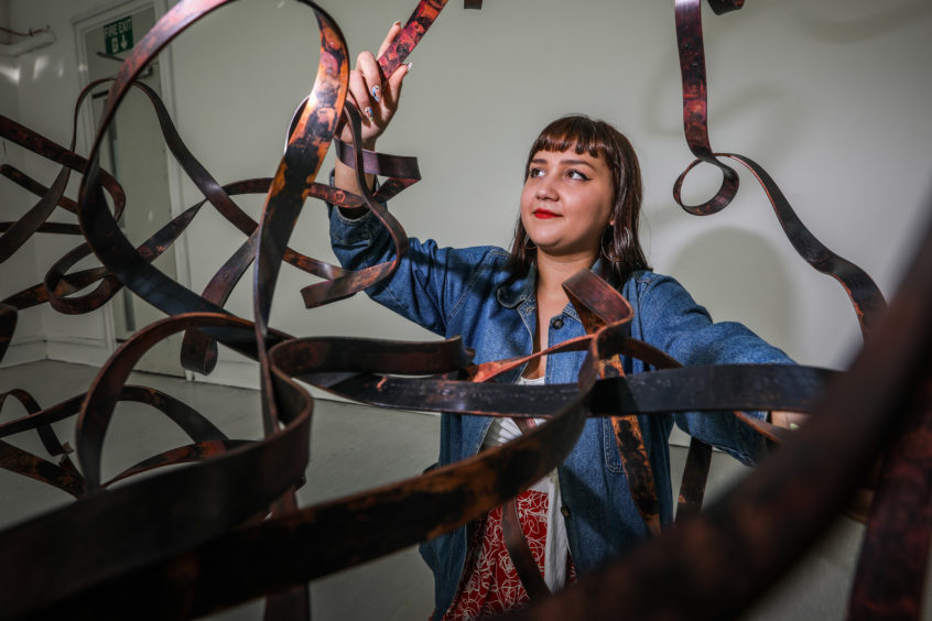 Student Saskia Singer with one of her pieces. Student Saskia Singer with one of her pieces.