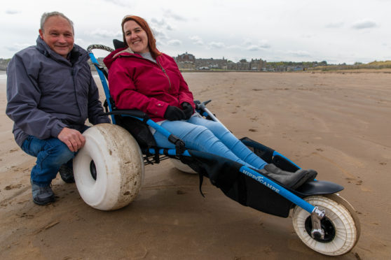 Amy Newton enjoying a trip to the beach with husband, Peter in 2019.