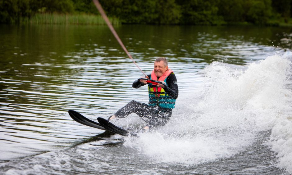 MSP Willie Rennie tries Waterskiing at Townill Loch in Dunfermline, 'riding the wave of possibility.'
