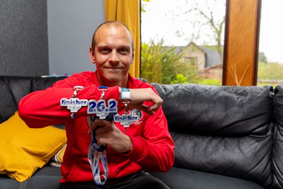 Mike with his medals.