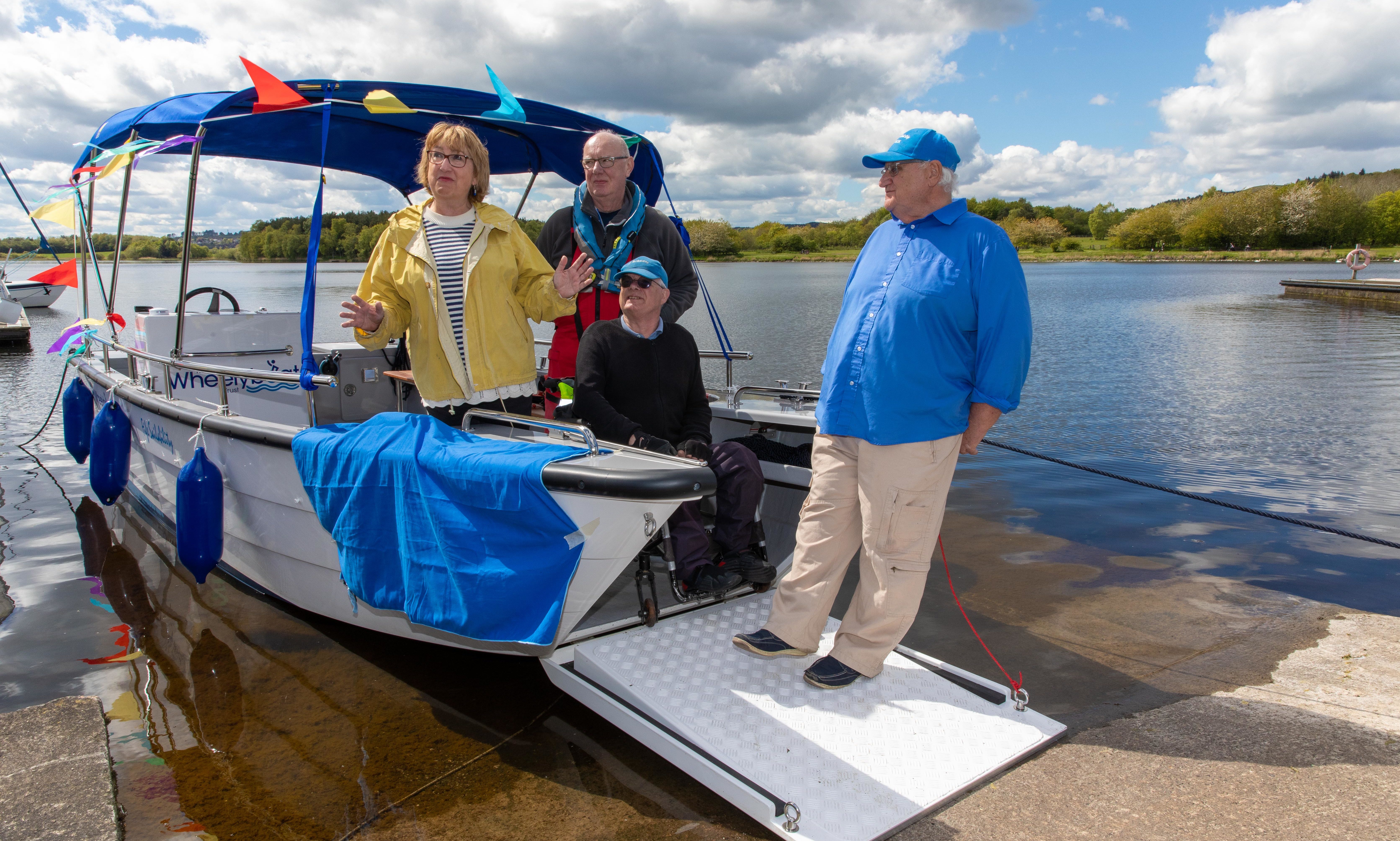 MSP Annabel Ewing, Jim Galloway, Ian Cameron and Merrick Yates, unveil the name of the new Sailability Boat 'Merri-Mac'.