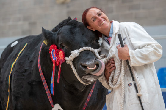 Kim Brown hugs Idvies Eland which sold for 7000gns.