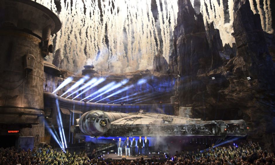 Fireworks go off during a dedication ceremony in front of the Millennium Falcon.