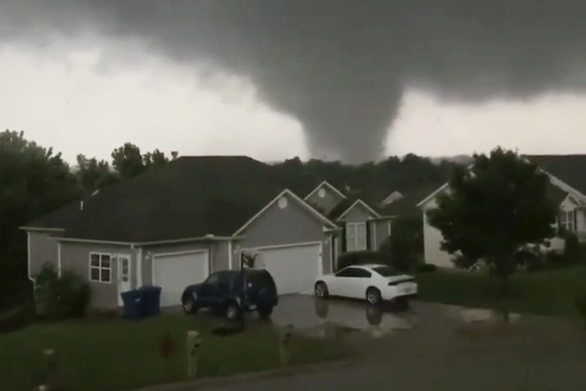 This still image taken from video provided by Chris Higgins shows a tornado in Carl Junction, Mo., on Wednesday, May 22, 2019. The tornado caused damage in the town about 4 miles (6.44 kilometers) north of the Joplin airport.