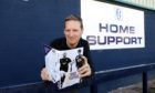 Graeme Strachan with his 2019 Dundee FC book.