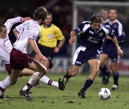 Caniggia powers through the Hearts defence.