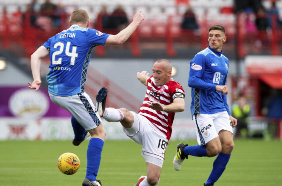 Hamilton's Darian McKinnon challenges St Johnstone's Brian Easton.