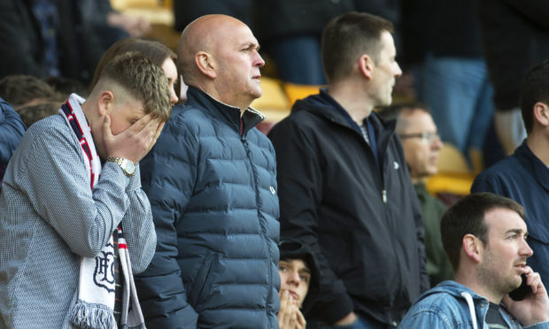 Dejected Dundee fans at Motherwell.