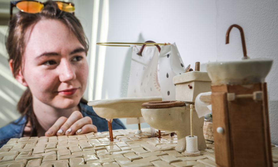 Eden Thomas, 21, sculpture artist with her miniature bathroom.