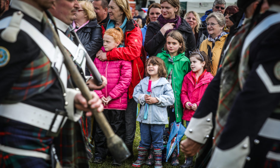 Mya Gallimore, 6, looks inquisitively at the Atholl Highlanders as they march past.