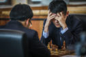 Ding Liren thinks about his next move.