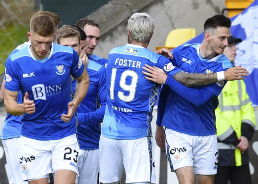 The St Johnstone players celebrate Scott Tanser's goal.