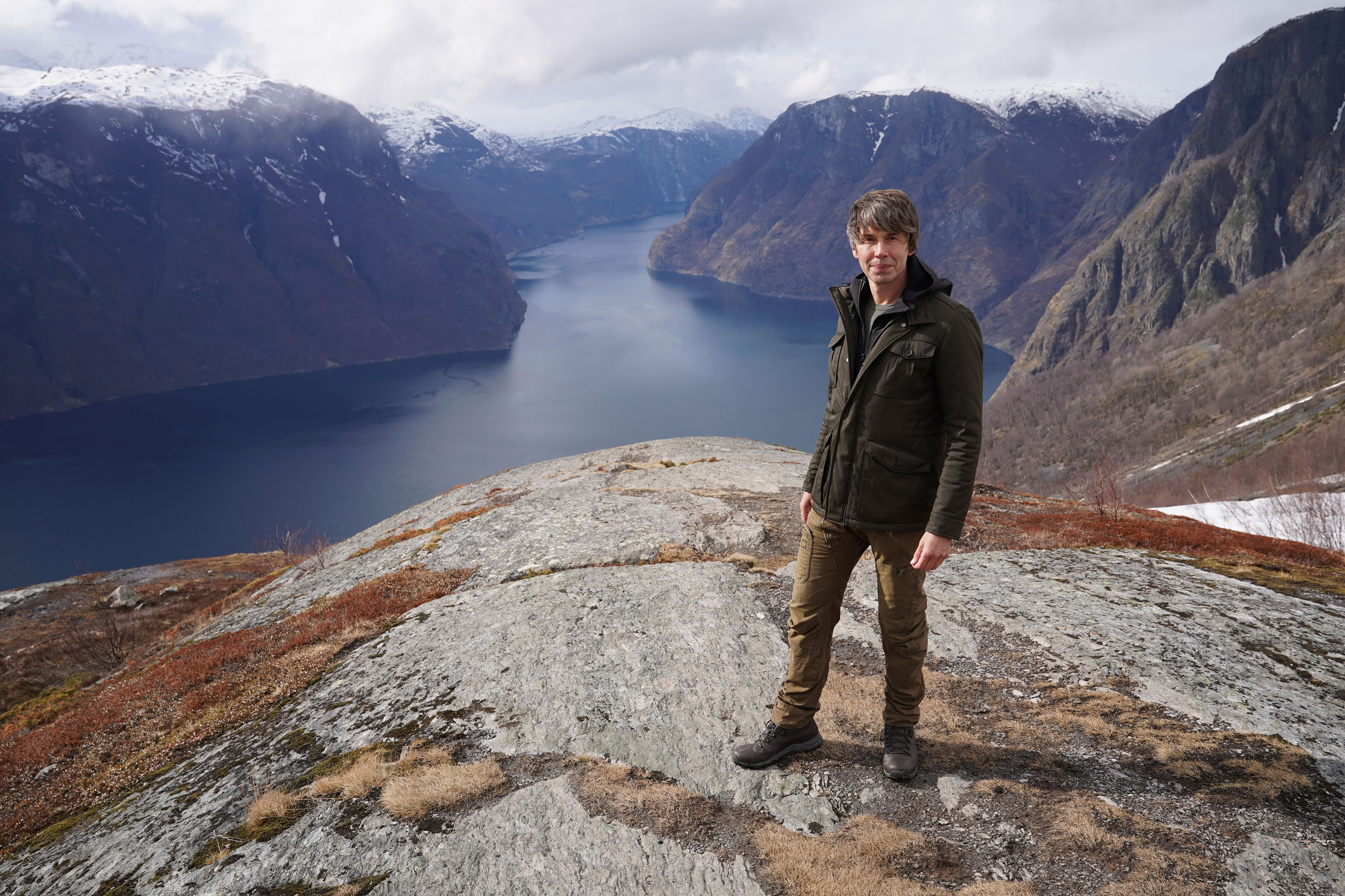 Professor Brian Cox on location at Stegastein, overlooking Aurlandsfjorden in Norway.
