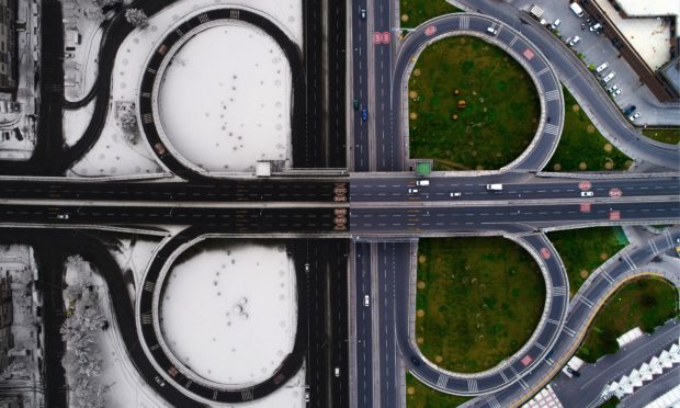 Drone photos show crossroads and changing seasons in single photo with the combination of snowy winter view and summer view in Kayseri province of Turkey.