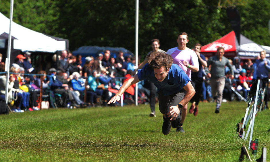 Connor McCormack from Australia falls at the finish line to be beaten in the visitors race.