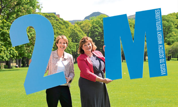 Scotch Whisky Association chief executive Karen Betts and cabinet secretary Fiona Hyslop celebrate Scottish whisky distilleries crossing the two million visitors mark last year.