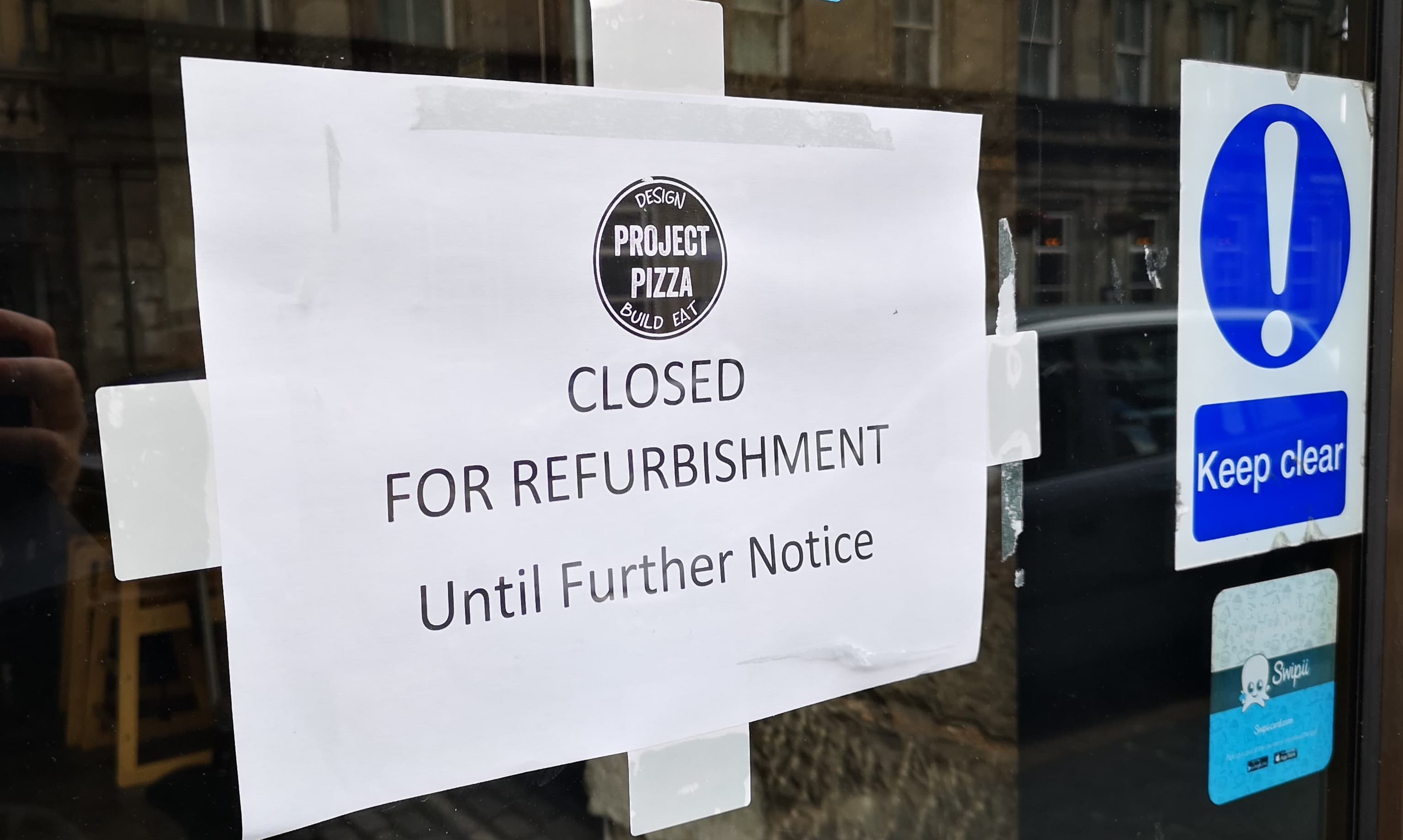 The sign on the front of Project Pizza in Dundee.