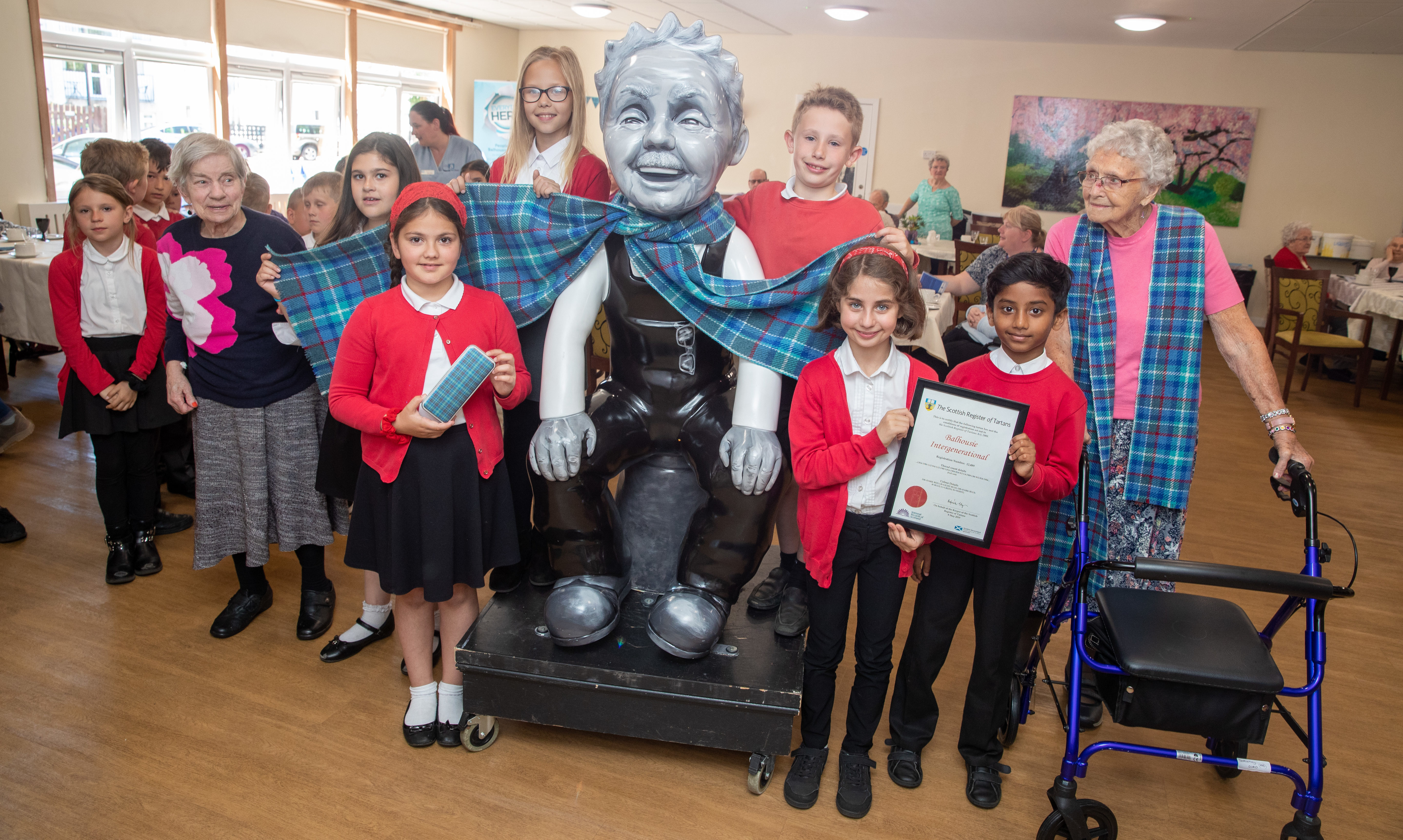 Residents of Balhousie North Inch North Grove and pupils from Balhousie Primary School celebrated the launch of their new Balhousie tartan, created in association with the Weaver Incorporation of Dundee.