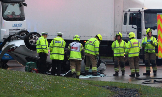 A man was taken to hospital after his car ended up on its roof at the Broxden Roundabout.