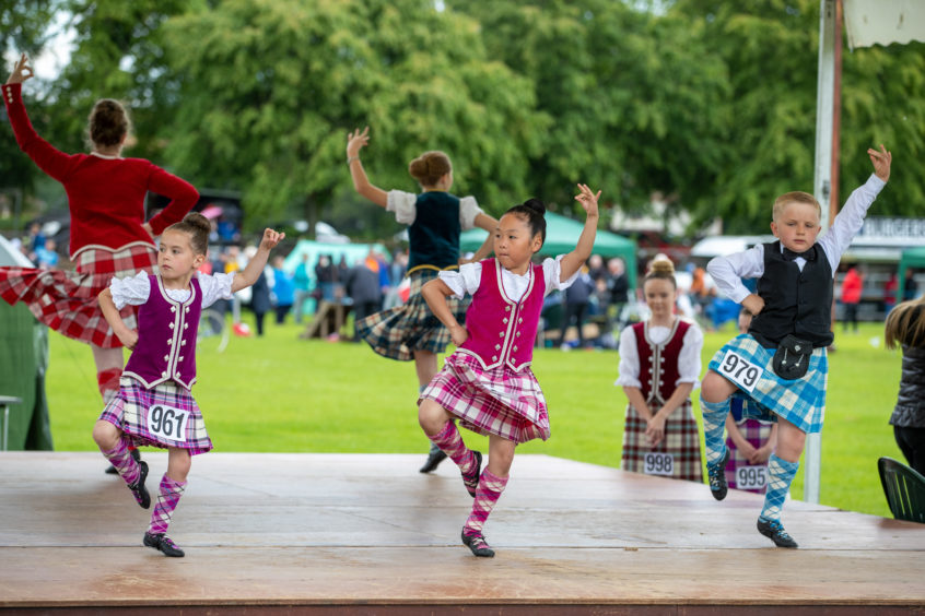 Highland dancers perform for the judges.