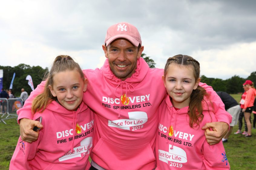 L/R, Lucy Conroy, Jim Bryceland and Grace Bryceland, at the Race For Life in Camperdown Park, Dundee.