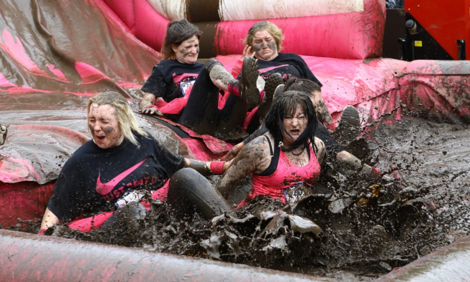 Participants embrace the mud.