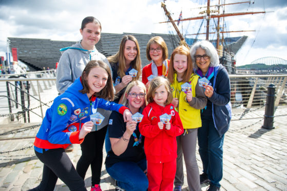 The Girl Guides with their new badge.