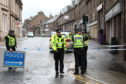 Police officers at the scene in Brechin yesterday morning.