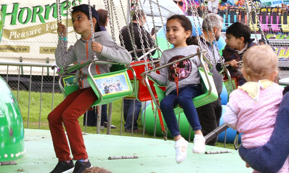 EID Festival in Camperdown park Dundee, fun on the swings.