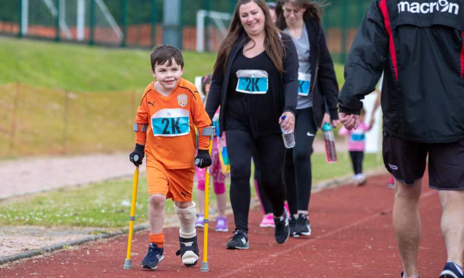 Harry Paterson who broke his leg whilst playing football 4 weeks ago still ran in the 2K race to help raise funds for his football team, Glenrothes Athletic.