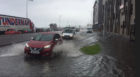 A car negotiates the flooding on Kirkcaldy Esplanade