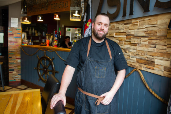 Scott Learmonth in his restaurant where he has introduced a phone ban to encourage his customers to talk to each other.