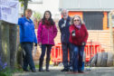Members of Carnoustie Petanque Club (and Gayle) in action.