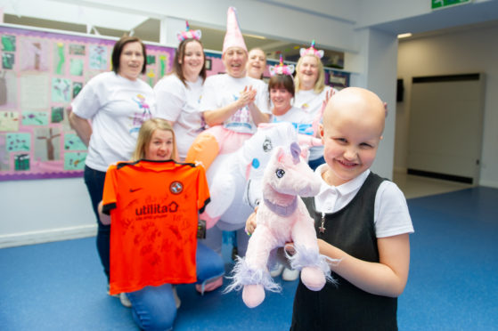 Back l to r - Marie McGregor, Jodie Hay (kneeling), Siobhan Paddick, Melanie Lochrie, Michelle Shepeherd, Cheryl Devaney and Lynsay Dow are all walking for Ruby (front)