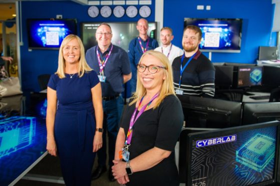 The team who created the new Cyber Security Lab - back l to r - George McAteer, Alex Alves, Adam Gummer and Ian Birchall - front - Gillian McGovern and Sharon Phillips.