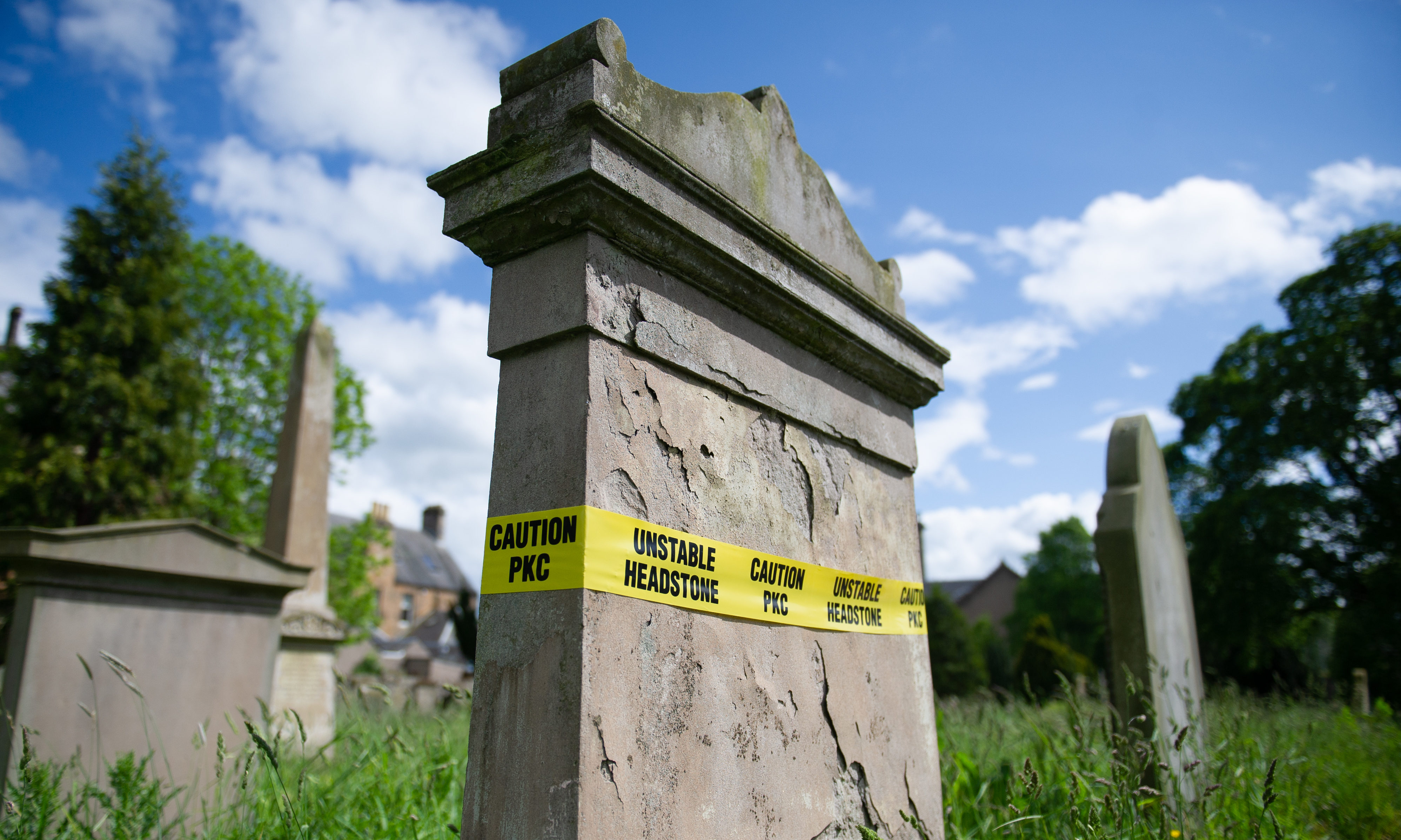 Tombstones in need of repair have been wrapped with safety tape at Greyfriars Burial Ground.