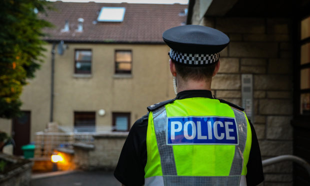 Police at the scene of the two deaths in Elie.