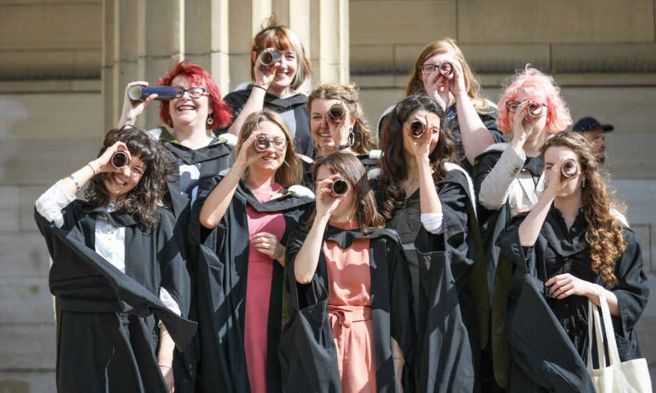 Jewellery design students celebrating after the afternoon graduation from University of Dundee.