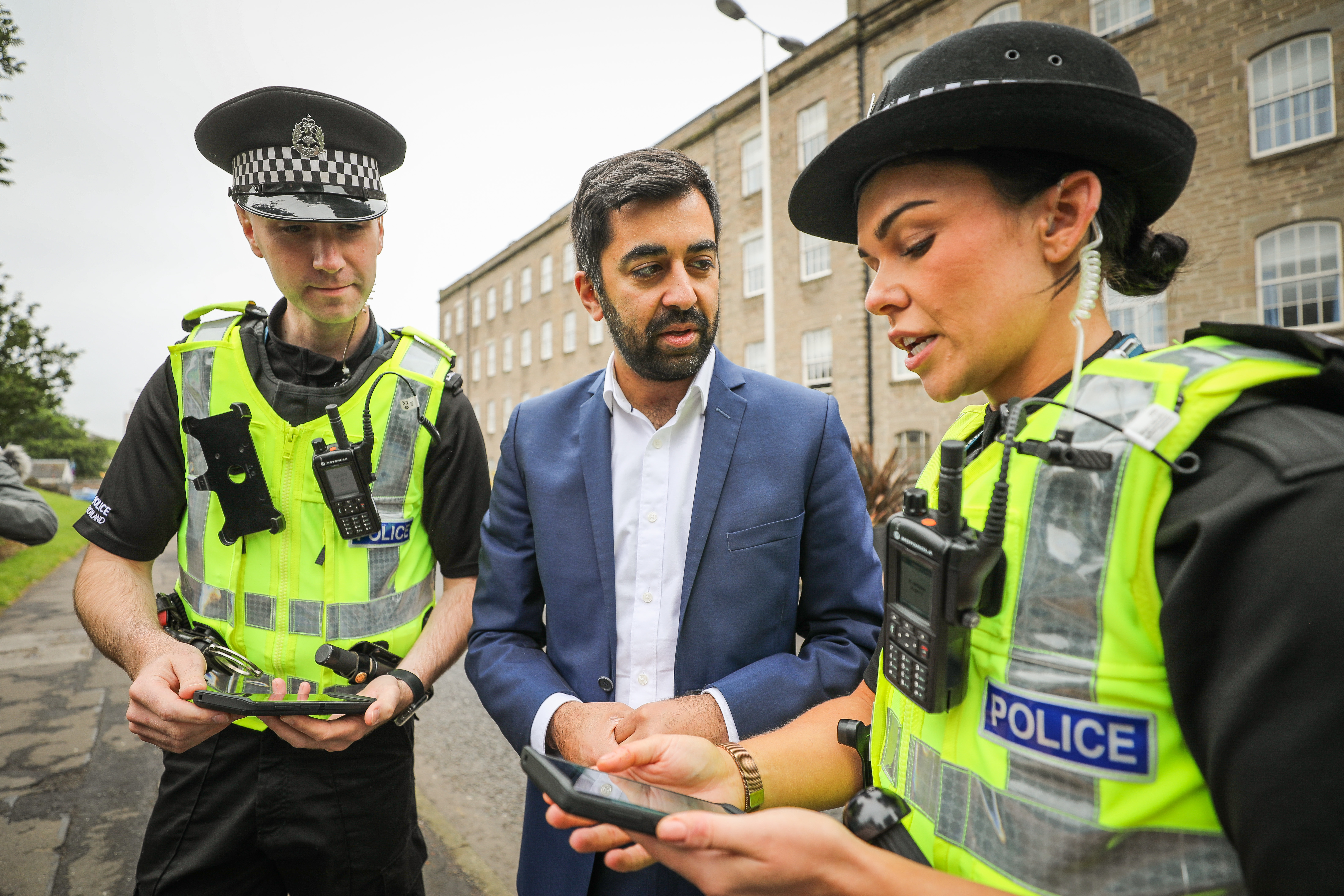 Justice Secretary Humza Yousaf chats to PC Scott Harris and PC Julie Donaldson