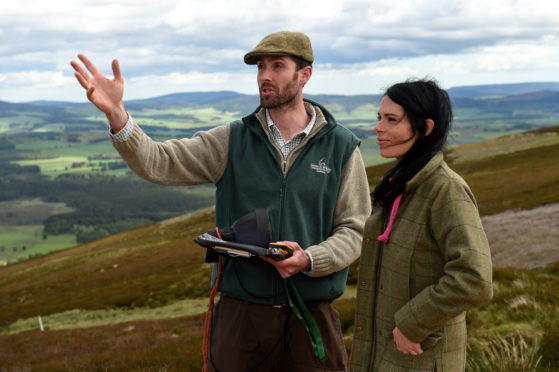 Merlin Becker shows Gayle Ritchie around the Game and Wildlife Scottish Demonstration Farm of Auchnerran near Logie Coldstone.