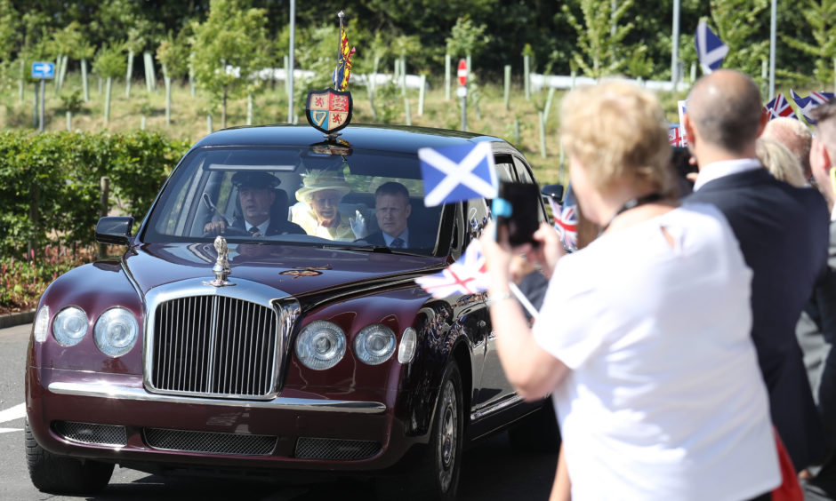 Queen Elizabeth II arrives at Greenfaulds High School in the west of Cumbernauld.