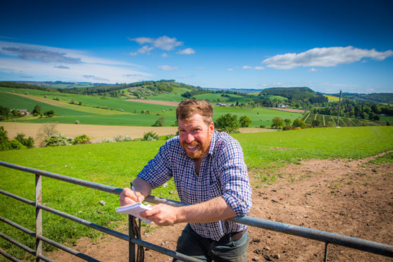 Jim Smith on his farm at Stralochy near Caputh with his notepad - in case he's inspired!