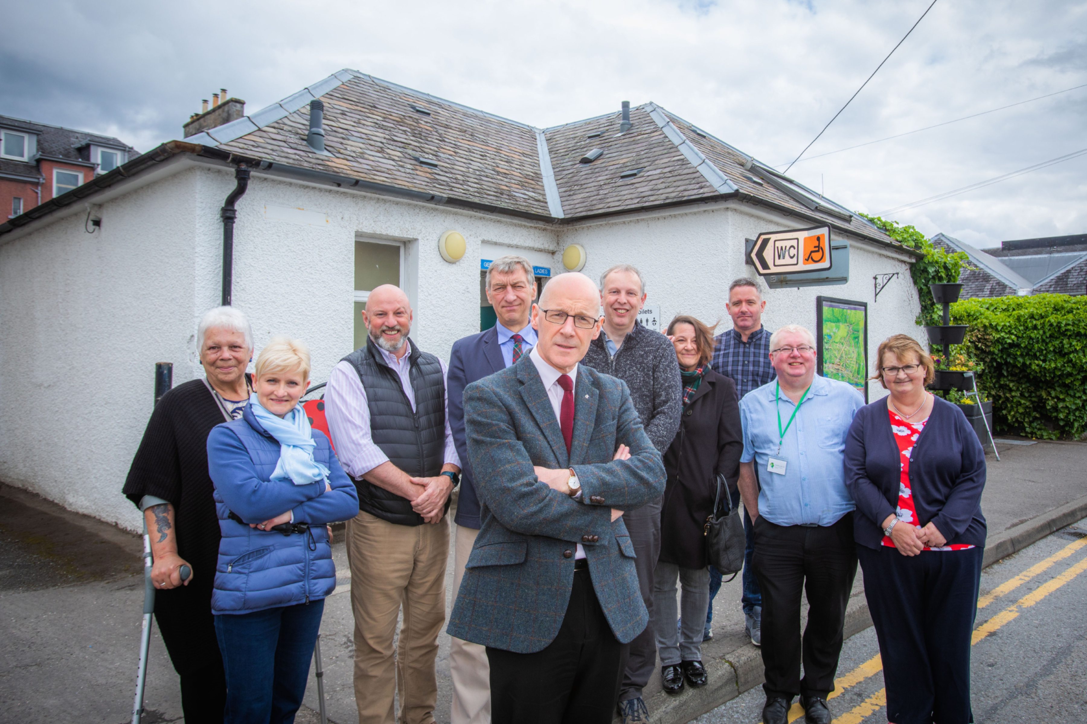 John Swinney MSP (front) and Councillor Mike Williamson (behind) meeting local business owners, members of Community Council and local residents to discuss their concerns. Public Toilets, West Lane, Pitlochry.