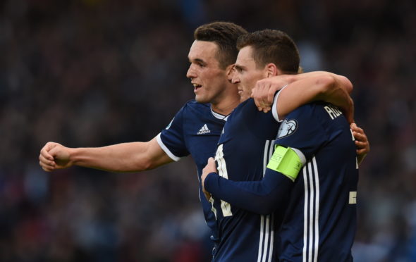 John McGinn joins in the celebrations after Andy Robertson's goal.