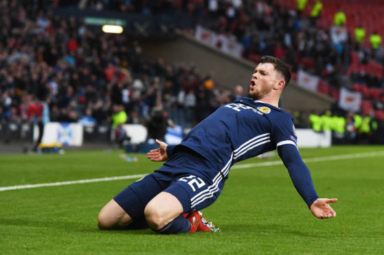 Oli Burke celebrates his winner.