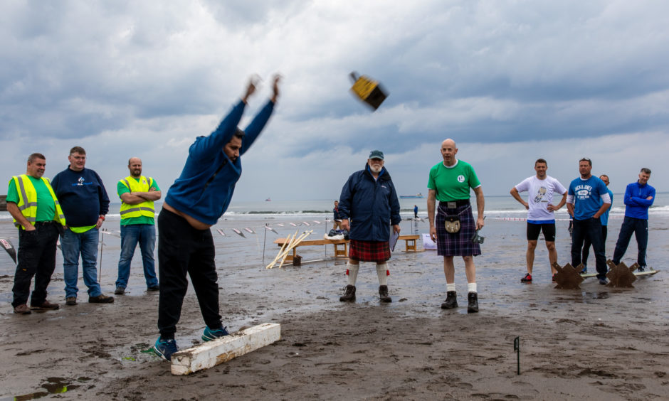 Members of the public compete in the block throw as part of the Beach Highland Games.
Steve Brown / DCT Media