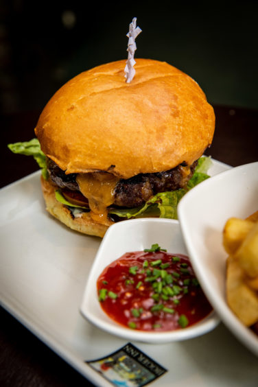 A burger and fries from the Jigger Inn menu
